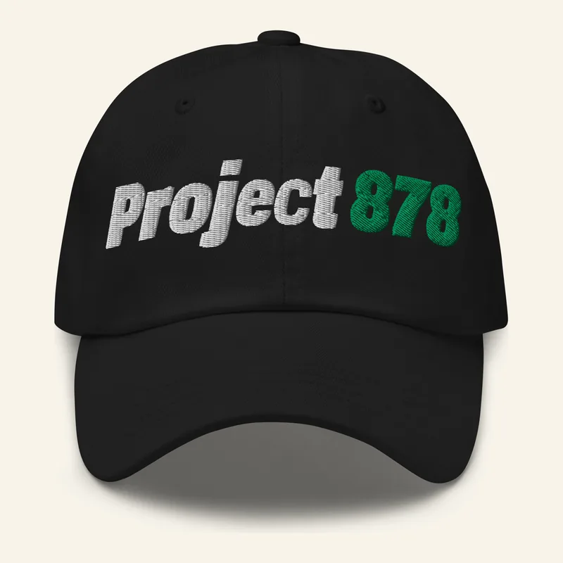 Black dad hat, front, with an embroidered Project 878 logo