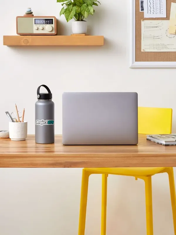 Water bottle with the Project 878 sticker on a desk